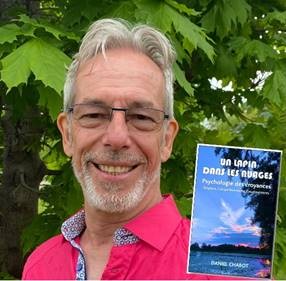 A person holding a bookDescription automatically generated